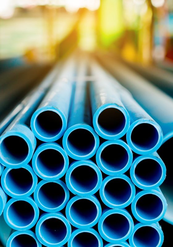 Close up to blue plastic pipe background, PVC pipes stacked in w